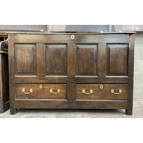 35 - A Georgian oak four panel mule chest - approx. 100cm high x 152cm wide x 67cm deep