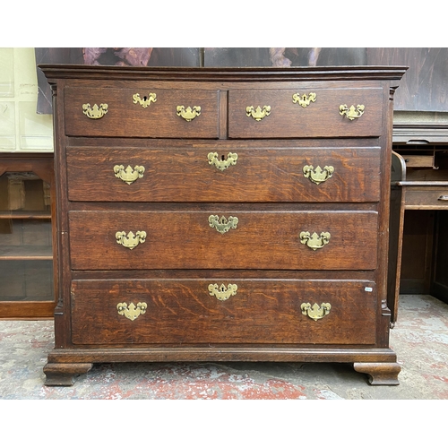 37 - A George III oak chest of drawers on bracket supports - approx. 117cm high x 130cm wide x 56cm deep