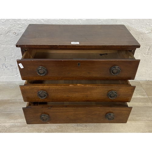 39A - A 19th century mahogany miniature chest of drawers - approx. 49cm high x 58cm wide x 28cm deep