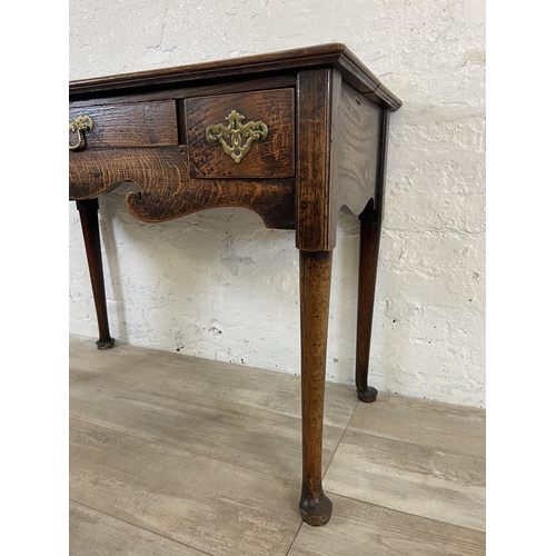 39B - A Georgian oak three drawer lowboy/side table on cabriole supports - approx. 72cm high x 97cm wide x... 