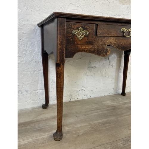 39B - A Georgian oak three drawer lowboy/side table on cabriole supports - approx. 72cm high x 97cm wide x... 