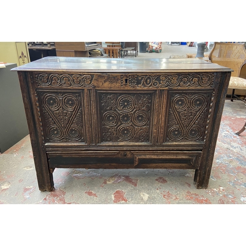 39C - A 18th century carved oak mule chest - approx. 85cm high x 120cm wide x 52cm deep