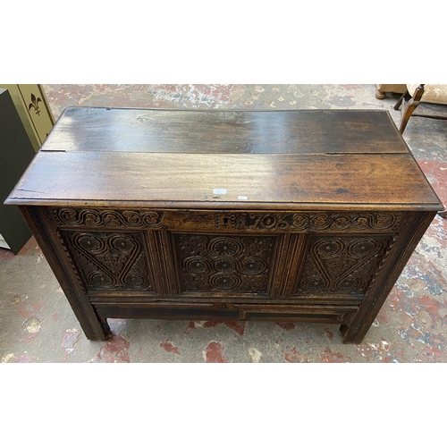 39C - A 18th century carved oak mule chest - approx. 85cm high x 120cm wide x 52cm deep