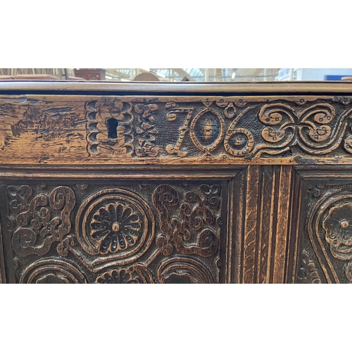 39C - A 18th century carved oak mule chest - approx. 85cm high x 120cm wide x 52cm deep