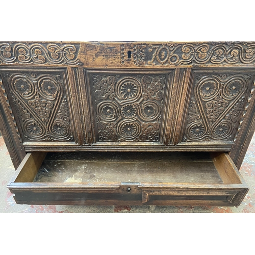 39C - A 18th century carved oak mule chest - approx. 85cm high x 120cm wide x 52cm deep