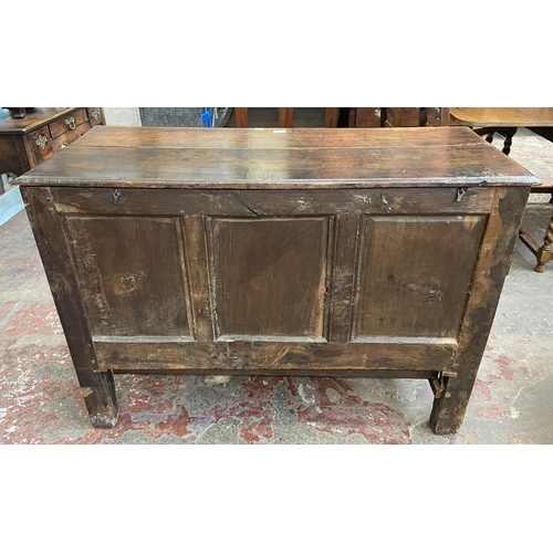 39C - A 18th century carved oak mule chest - approx. 85cm high x 120cm wide x 52cm deep