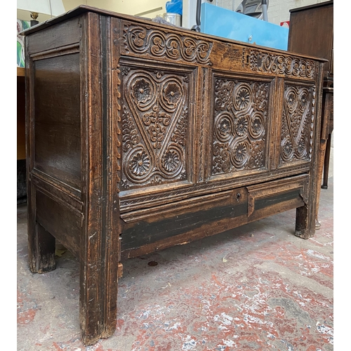 39C - A 18th century carved oak mule chest - approx. 85cm high x 120cm wide x 52cm deep