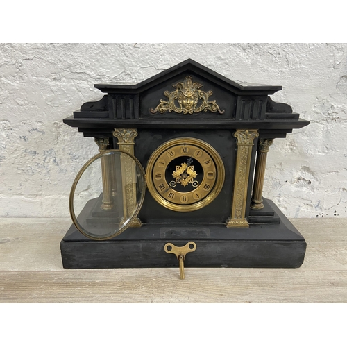 3A - A Victorian black slate chiming mantel clock with brass decoration, Corinthian columns and key - app... 