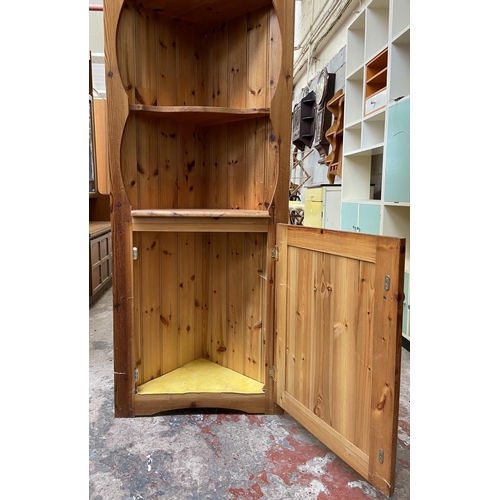 45 - A pine free standing corner cabinet - approx. 183cm high