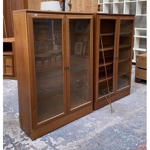 48 - Two mid 20th century teak display cabinets - approx. 124cm high x 82cm wide x 30cm deep