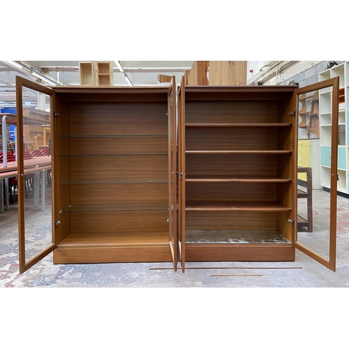 48 - Two mid 20th century teak display cabinets - approx. 124cm high x 82cm wide x 30cm deep