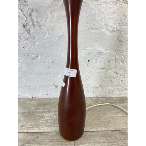 49 - A mid 20th century teak table lamp with shade - approx. 57cm high