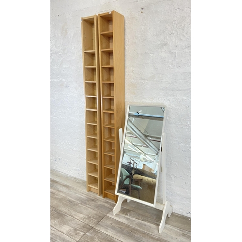 51 - Three pieces of furniture, two modern beech CD shelving units - approx. 202cm high and one mid 20th ... 