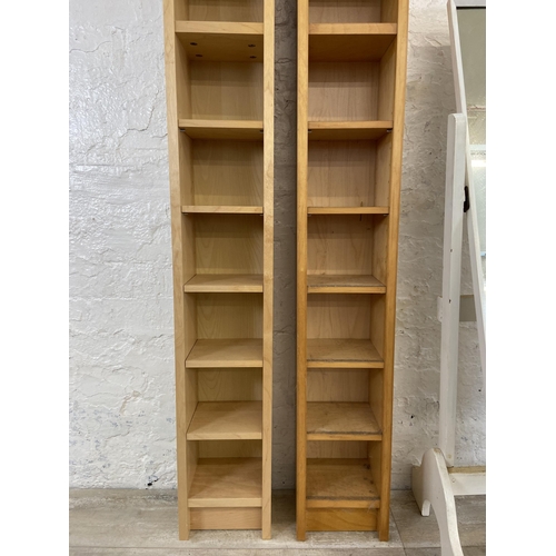 51 - Three pieces of furniture, two modern beech CD shelving units - approx. 202cm high and one mid 20th ... 