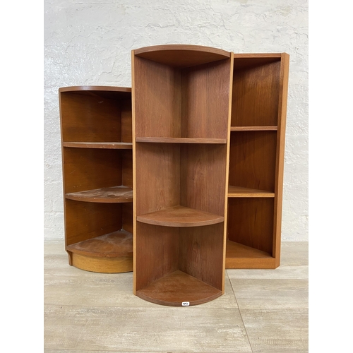 55 - Three mid 20th century teak corner shelving units