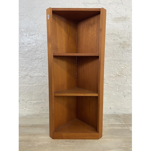 55 - Three mid 20th century teak corner shelving units