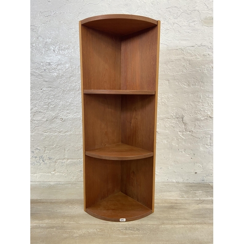 55 - Three mid 20th century teak corner shelving units