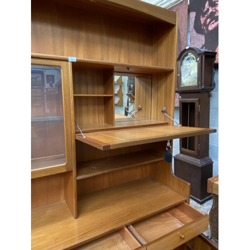 57 - A Nathan Squares teak wall unit - approx. 194cm high x 152cm wide x 45cm deep