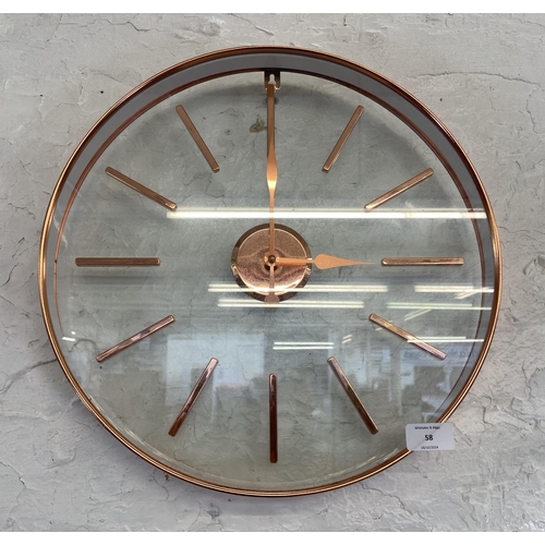 58 - A modern copper effect framed circular quartz wall clock - approx. 40cm diameter