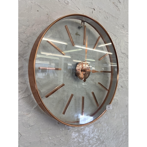 58 - A modern copper effect framed circular quartz wall clock - approx. 40cm diameter