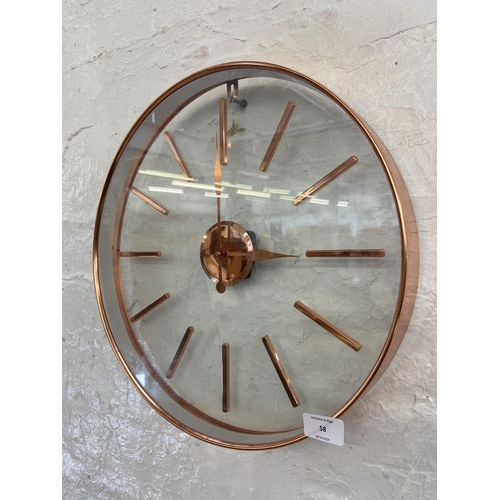 58 - A modern copper effect framed circular quartz wall clock - approx. 40cm diameter