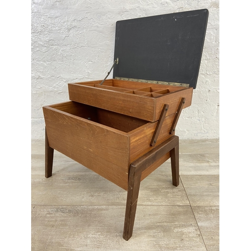 59 - A mid 20th century teak and black painted concertina sewing box - approx. 44cm high x 52cm wide x 30... 