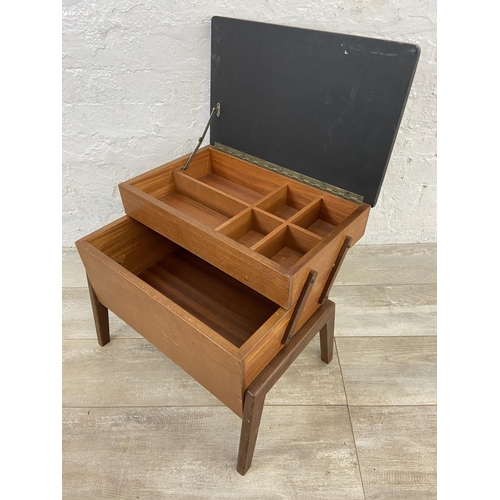 59 - A mid 20th century teak and black painted concertina sewing box - approx. 44cm high x 52cm wide x 30... 