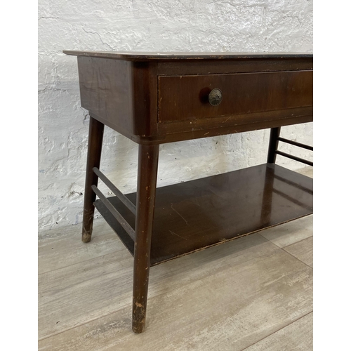 60 - A mid 20th century walnut single drawer two tier coffee table - approx. 52cm high x 40cm wide x 76cm... 