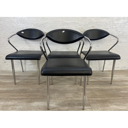 63 - Four chrome plated and black vinyl dining chairs