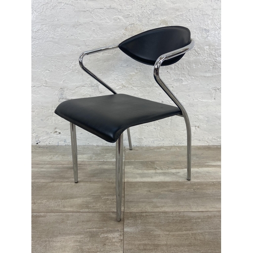 63 - Four chrome plated and black vinyl dining chairs