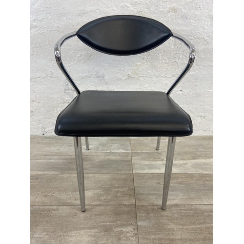 63 - Four chrome plated and black vinyl dining chairs