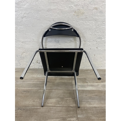 63 - Four chrome plated and black vinyl dining chairs