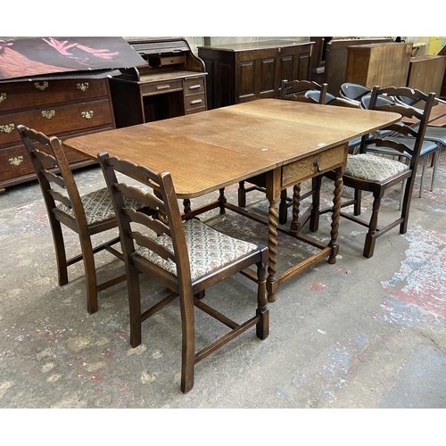 63C - An early 20th century oak drop leaf gate leg dining table on barley twist supports and four 19th cen... 