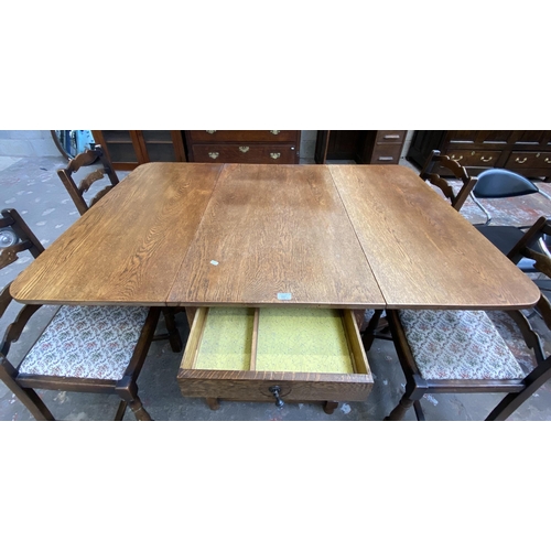 63C - An early 20th century oak drop leaf gate leg dining table on barley twist supports and four 19th cen... 