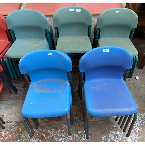 79 - Thirty mid/late 20th century plastic and tubular metal stacking children's school chairs