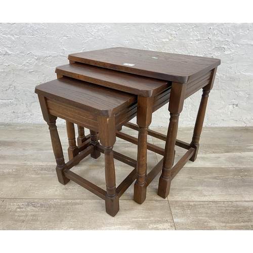 85 - An oak nest of tables - approx. 47cm high x 51cm wide x 34cm deep