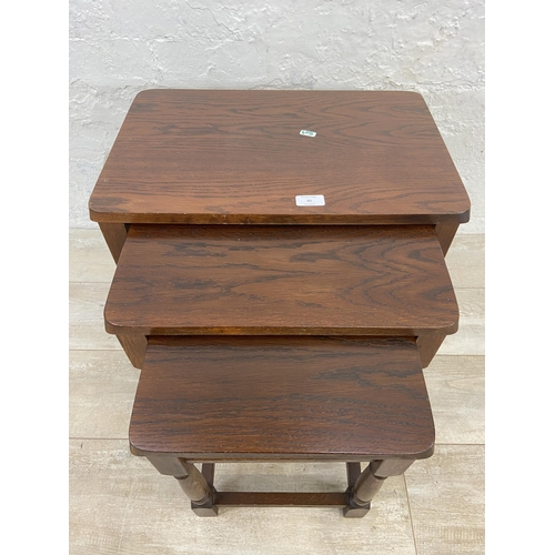 85 - An oak nest of tables - approx. 47cm high x 51cm wide x 34cm deep