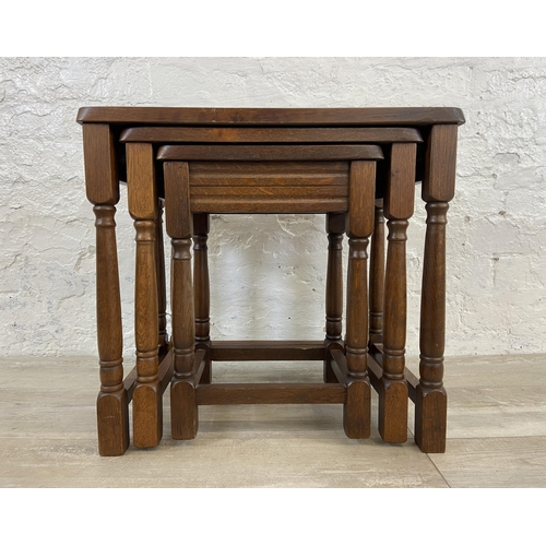 85 - An oak nest of tables - approx. 47cm high x 51cm wide x 34cm deep