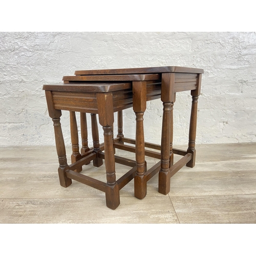 85 - An oak nest of tables - approx. 47cm high x 51cm wide x 34cm deep