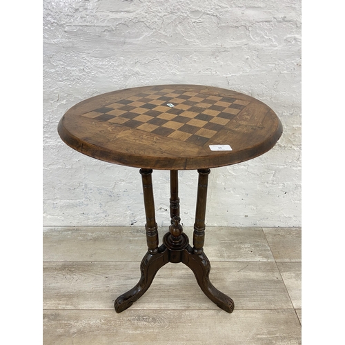 86 - A Victorian inlaid walnut circular tripod pedestal chess table - approx. 66cm high x 53cm diameter