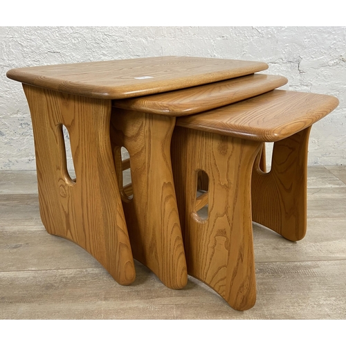 9 - An Ercol Windsor blonde elm nest of tables - approx. 45cm high x 63cm wide x 41cm deep