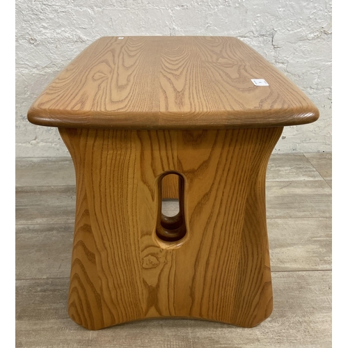 9 - An Ercol Windsor blonde elm nest of tables - approx. 45cm high x 63cm wide x 41cm deep