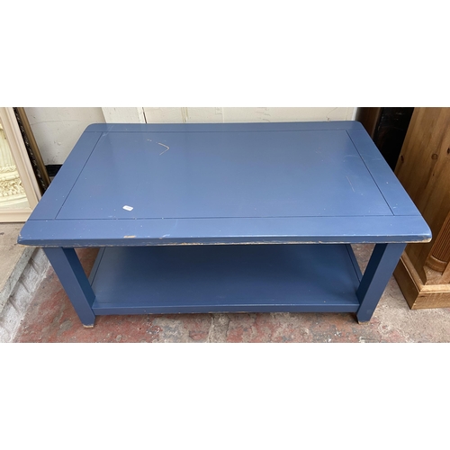 96 - Two modern coffee tables, one gilt metal oval two tier with mirrored glass and one blue painted rect... 