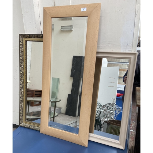 97 - Three framed wall mirrors, one gilt, one beech effect and one painted