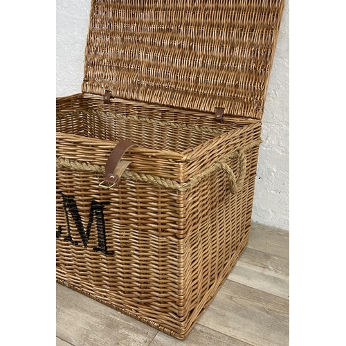 105 - A Fortnum & Mason wicker basket with rope handles - approx. 48cm high x 79cm wide x 51cm deep