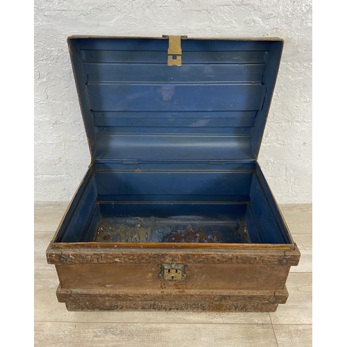 106 - An early 20th century painted metal travel trunk - approx. 43cm high x 66cm wide x 47cm deep