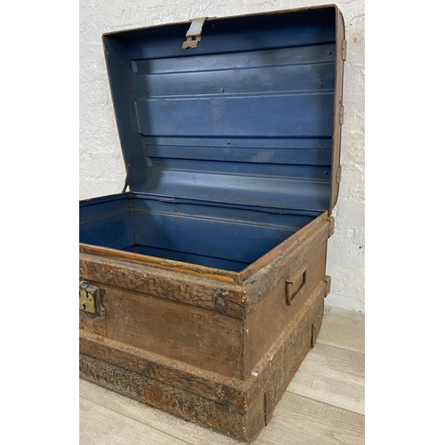 106 - An early 20th century painted metal travel trunk - approx. 43cm high x 66cm wide x 47cm deep