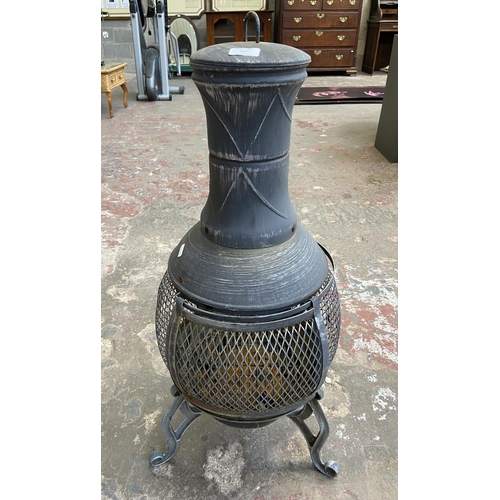 107 - A cast metal garden chiminea - approx. 87cm high