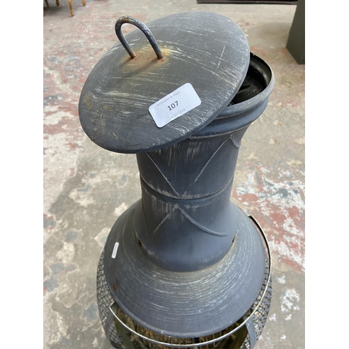 107 - A cast metal garden chiminea - approx. 87cm high