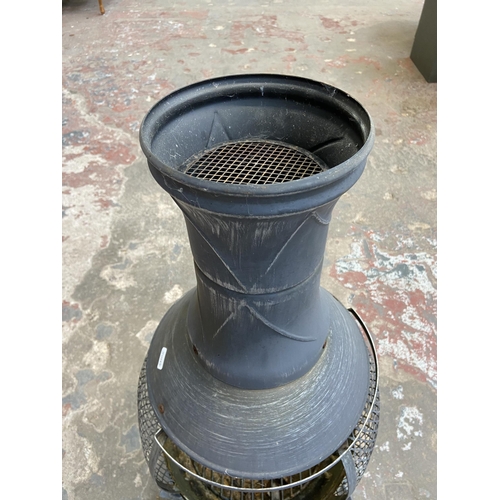 107 - A cast metal garden chiminea - approx. 87cm high